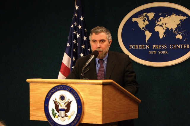 Paul Krugman at the mic, telling another gag